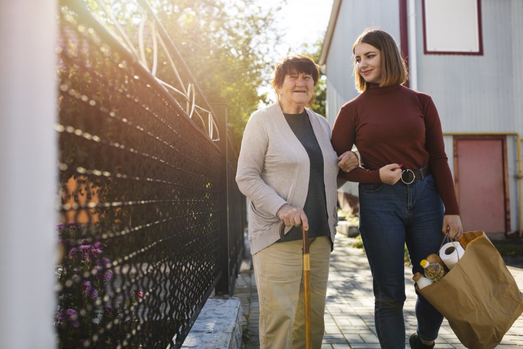 ok-person-helping-their-elder-neighbour
